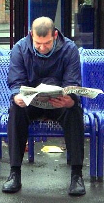 man reading newspaper